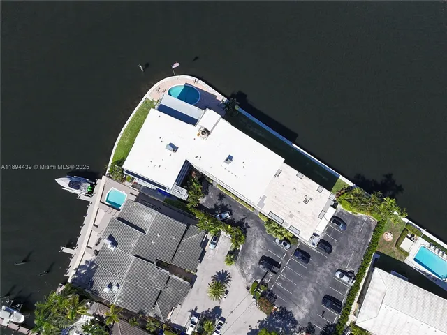 an aerial view of house with yard