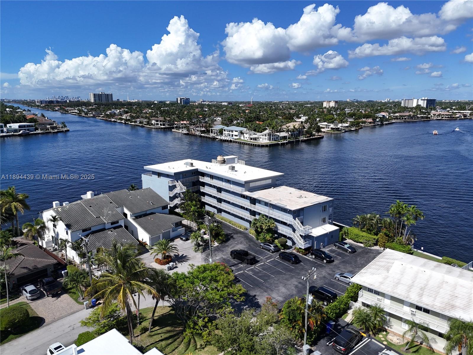 1201 South Riverside Drive, Unit 301 Pompano Beach, FL 33062 - Photo 22 of 24 an aerial view of a house with a lake view and boat