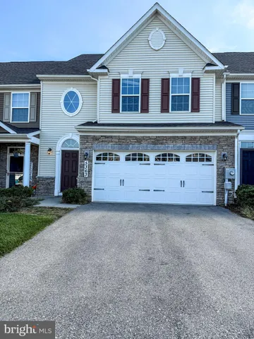 a view of a house with a street