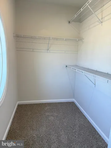 a view of a room with racks on the wall