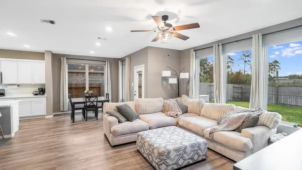 a living room with furniture and a large window