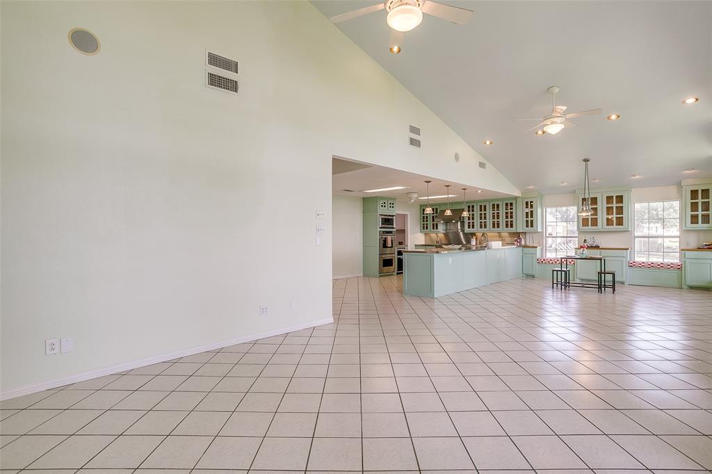 11484 Moran Road Azle, TX 76020 - Photo 13 of 40 Bonus room with high vaulted ceiling, ceiling fan, light tile patterned flooring, and recessed lighting