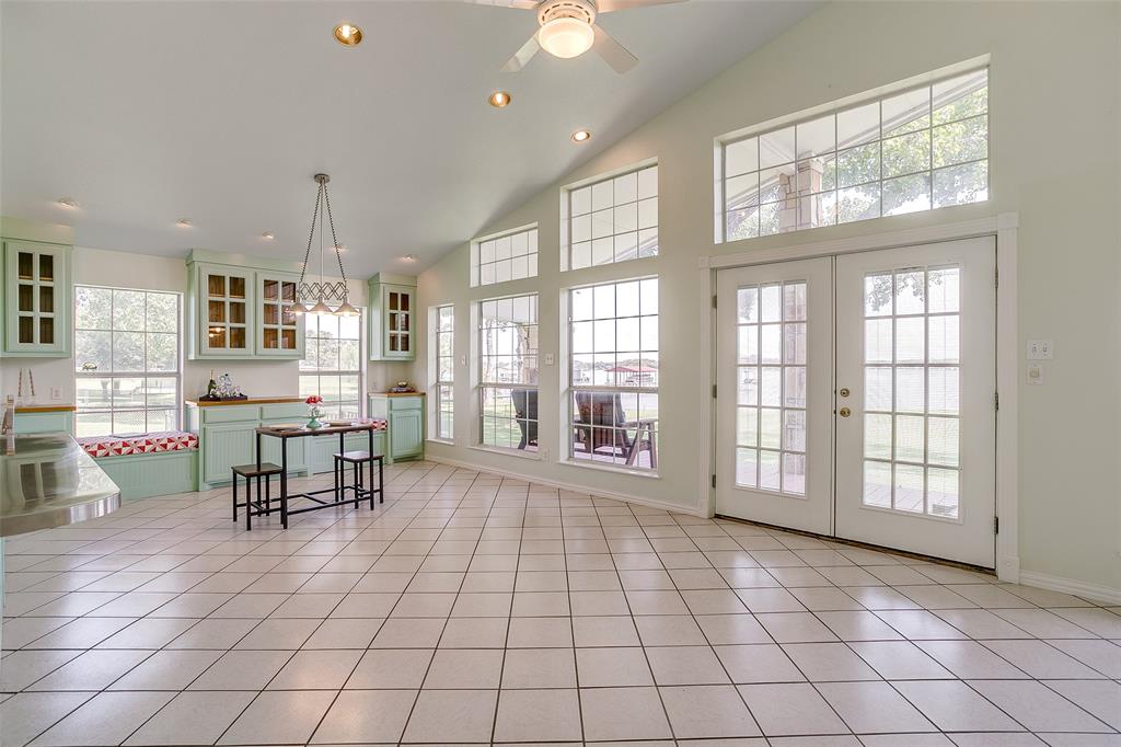 11484 Moran Road Azle, TX 76020 - Photo 14 of 40 Dining area with recessed lighting, high vaulted ceiling, light tile patterned floors, french doors, and ceiling fan