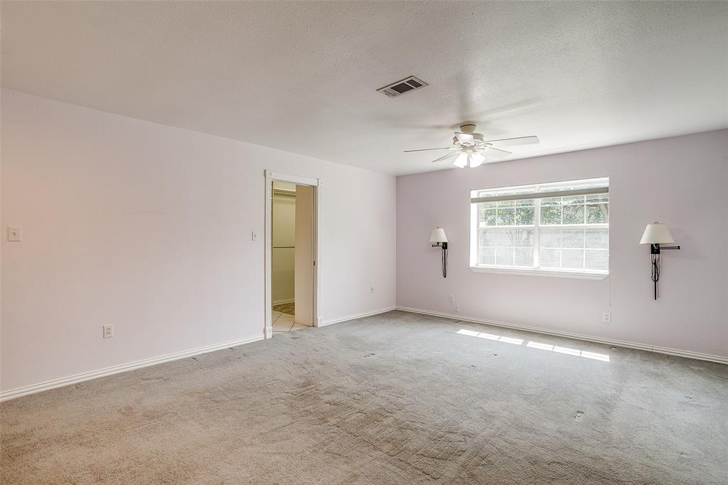 11484 Moran Road Azle, TX 76020 - Photo 19 of 40 room featuring light carpet, a ceiling fan