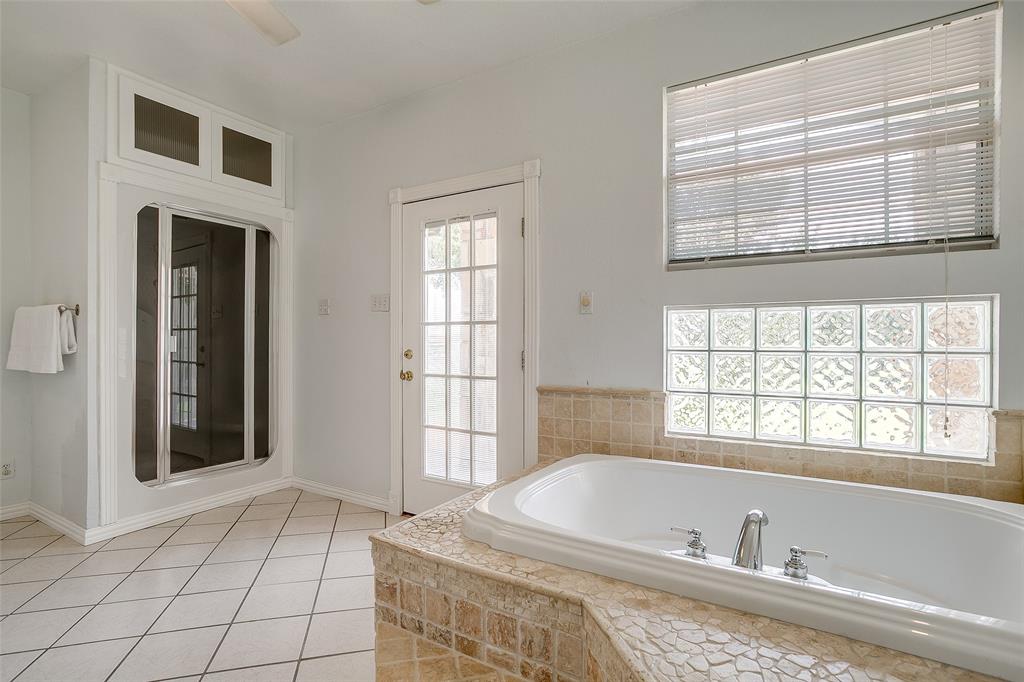 11484 Moran Road Azle, TX 76020 - Photo 22 of 40 Full bath with a garden tub and light tile patterned floors