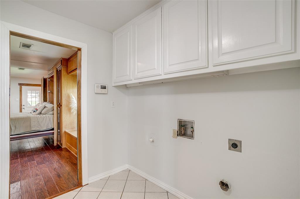 11484 Moran Road Azle, TX 76020 - Photo 26 of 40 Laundry room with washer and dryer hookup, light wood-type flooring,