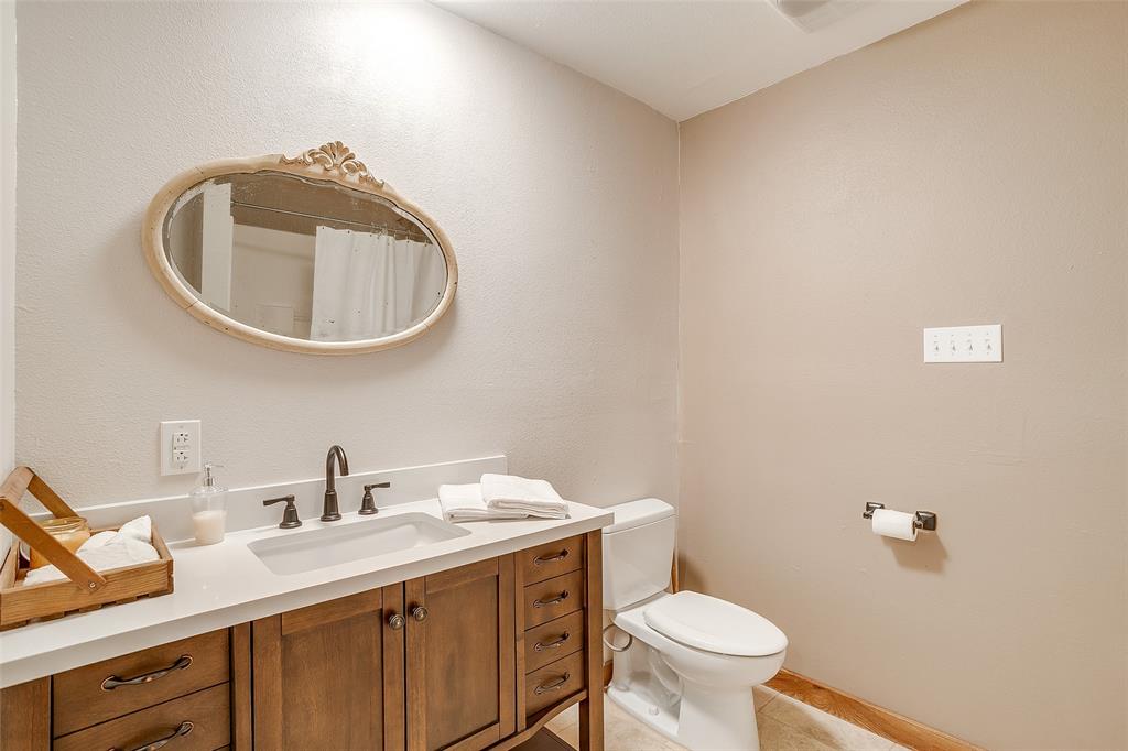 11484 Moran Road Azle, TX 76020 - Photo 29 of 40 Full bathroom with vanity, light tile patterned floors, and a shower with shower curtain
