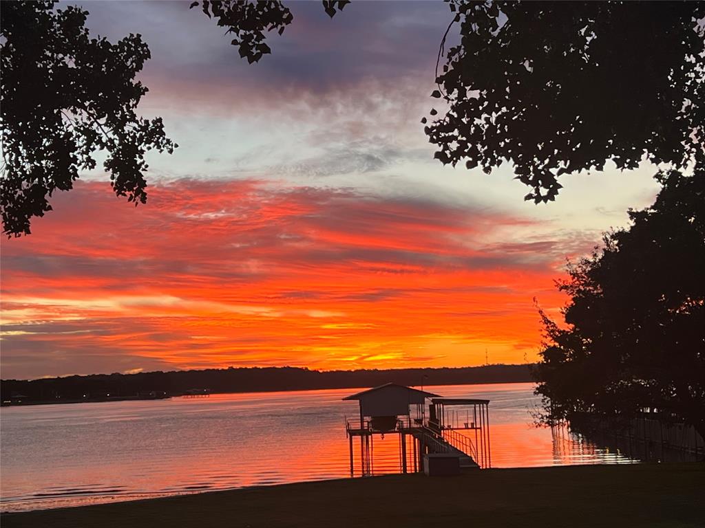 11484 Moran Road Azle, TX 76020 - Photo 39 of 40 Water view featuring a dock and boat lift