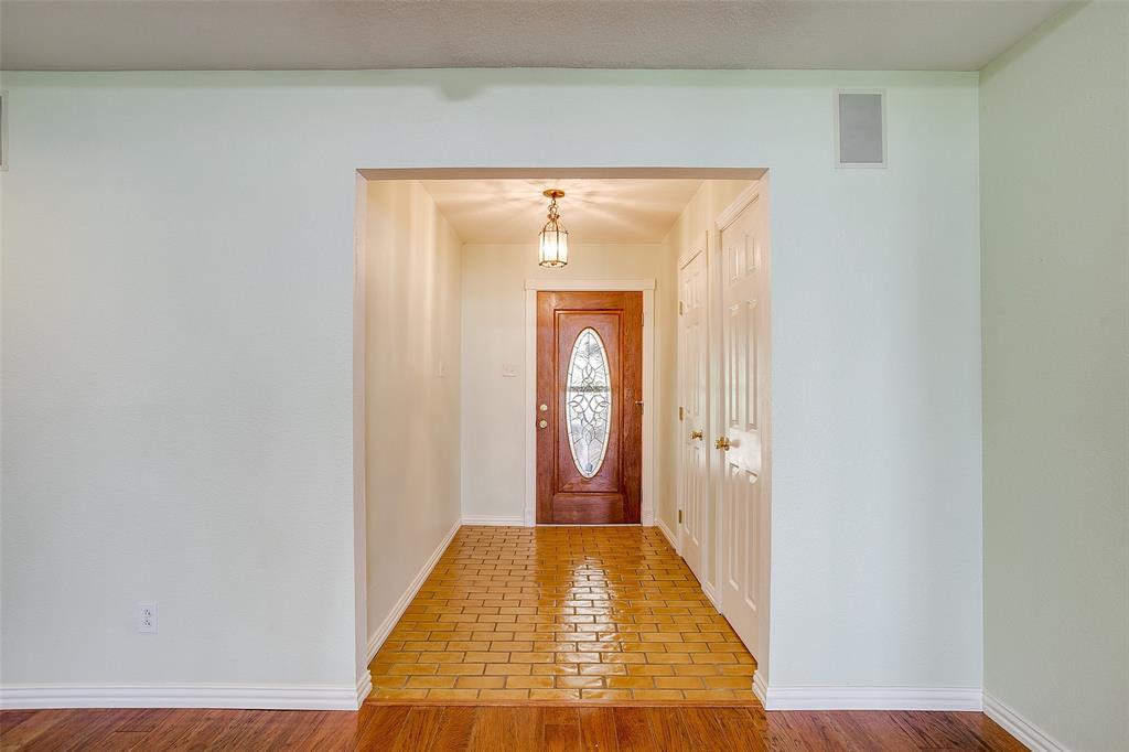 11484 Moran Road Azle, TX 76020 - Photo 6 of 40 Doorway featuring baseboards and wood finished floors