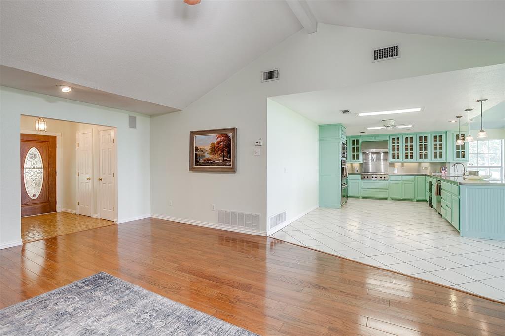 11484 Moran Road Azle, TX 76020 - Photo 9 of 40 living room with light wood-style flooring, a ceiling fan, beam ceiling, and high vaulted ceiling