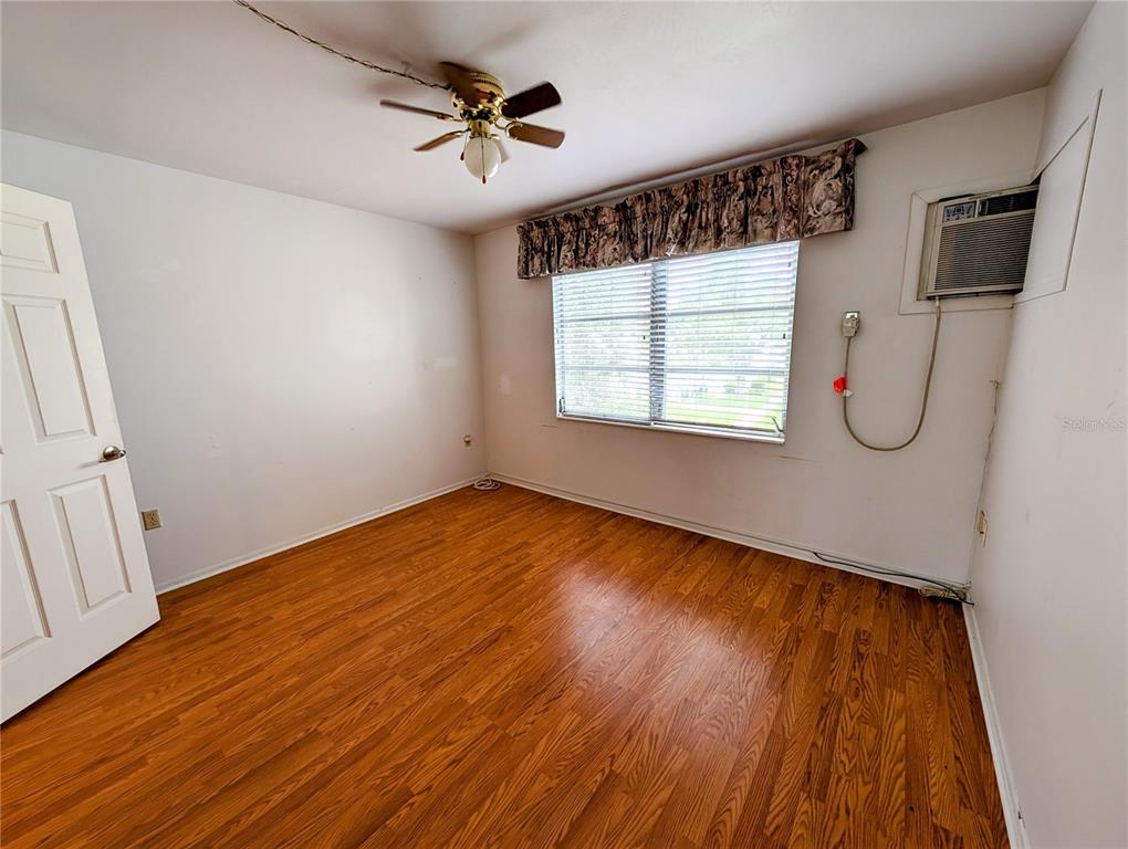 5908 17th Street West, Unit C36 Bradenton, FL 34207 - Photo 11 of 28 a view of a room with wooden floor and windows
