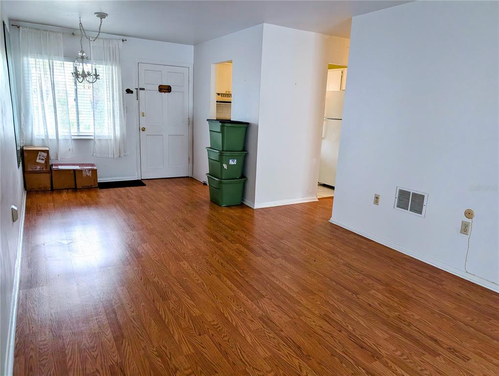 5908 17th Street West, Unit C36 Bradenton, FL 34207 - Photo 5 of 28 a view of empty room with wooden floor and fan