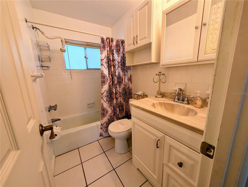 5908 17th Street West, Unit C36 Bradenton, FL 34207 - Photo 9 of 28 a bathroom with a sink a toilet and shower