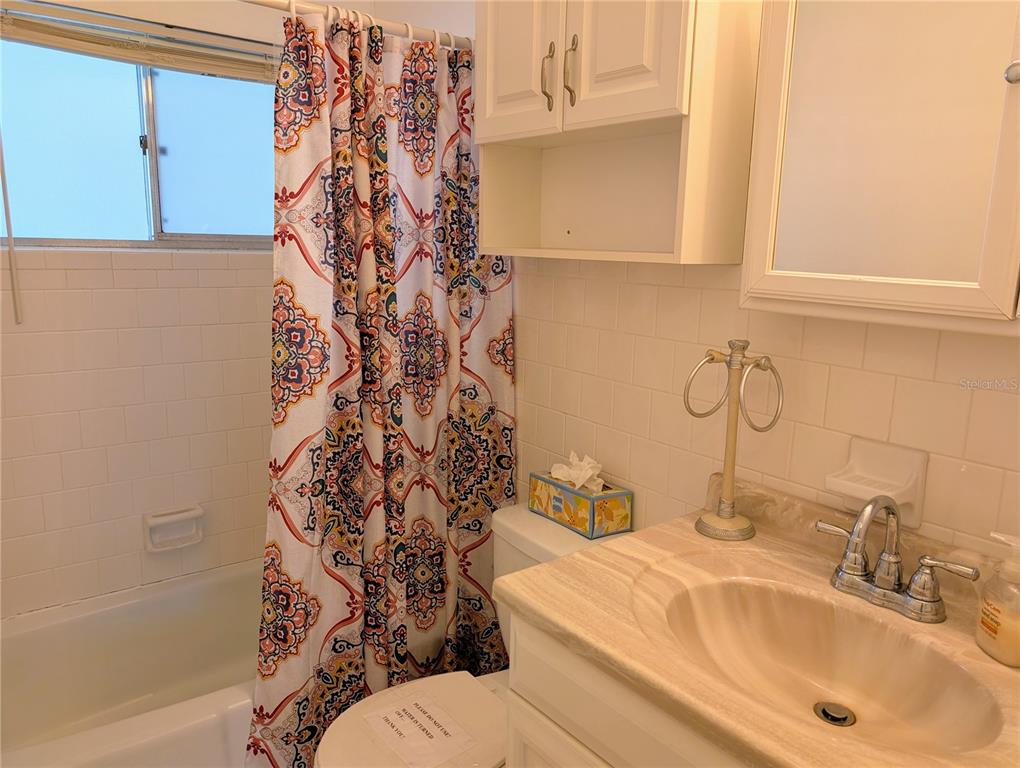5908 17th Street West, Unit C36 Bradenton, FL 34207 - Photo 10 of 28 a bathroom with a sink and mirror with toilet