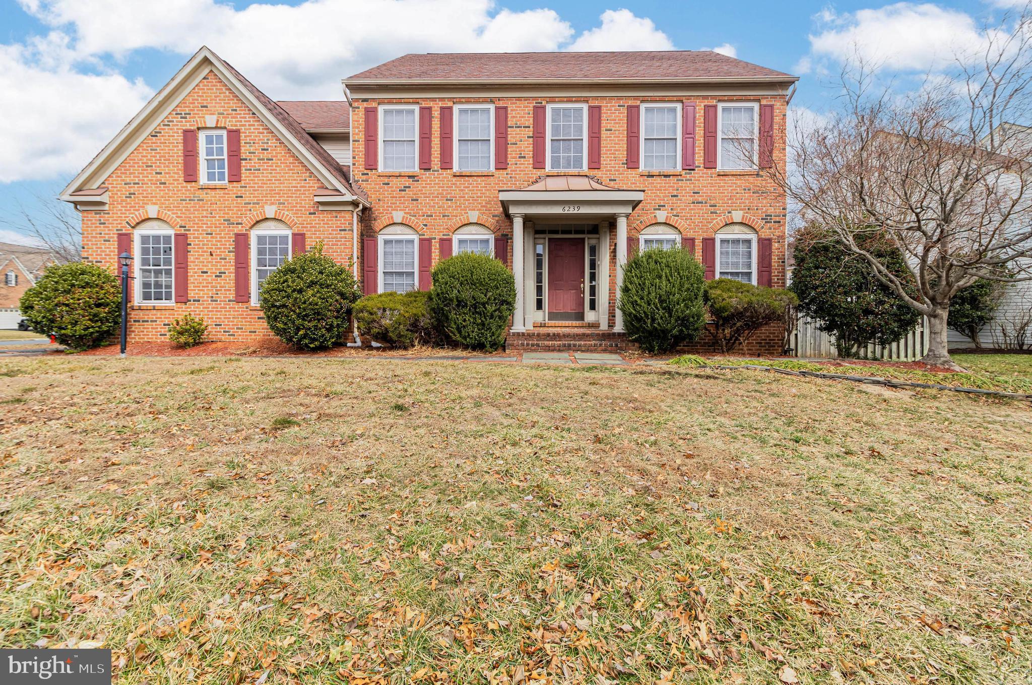 6239 Willowfield Way Springfield, VA 22150 - Photo 1 of 45 a front view of a house with a yard