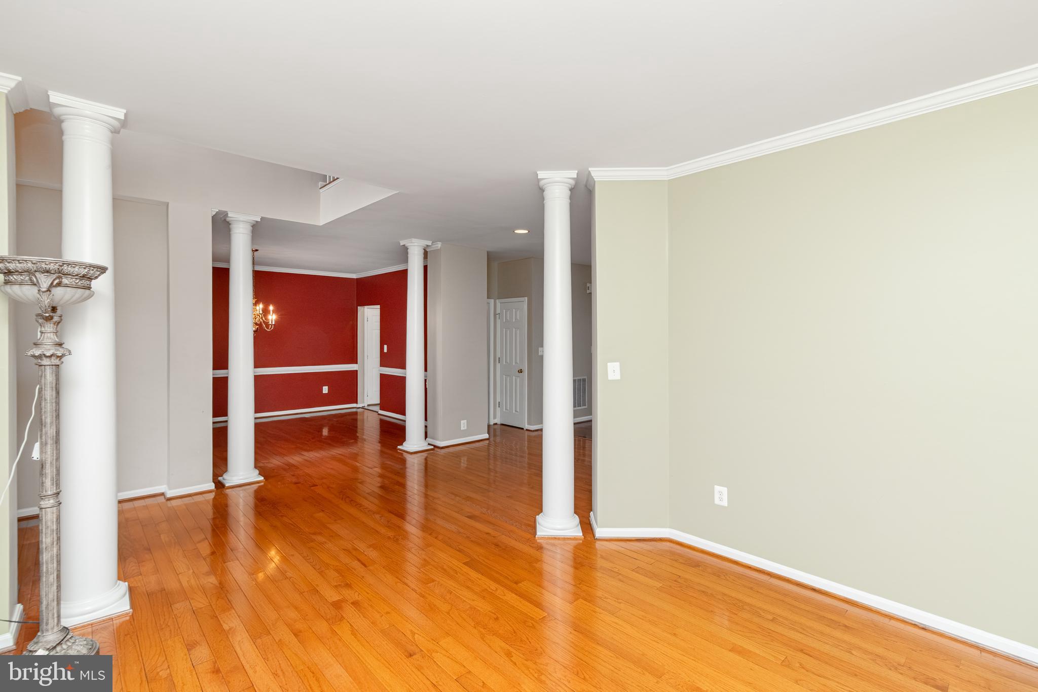 6239 Willowfield Way Springfield, VA 22150 - Photo 18 of 45 a view of an empty room with wooden floor and a window