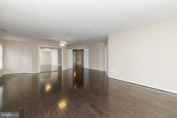 a view of a kitchen with wooden floor
