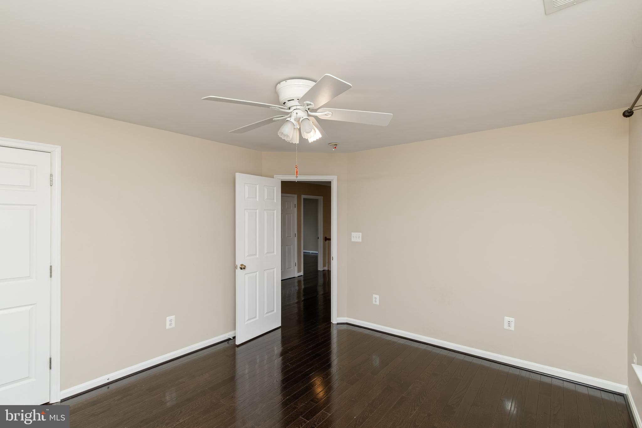 6239 Willowfield Way Springfield, VA 22150 - Photo 35 of 45 an empty room with a ceiling fan and a window