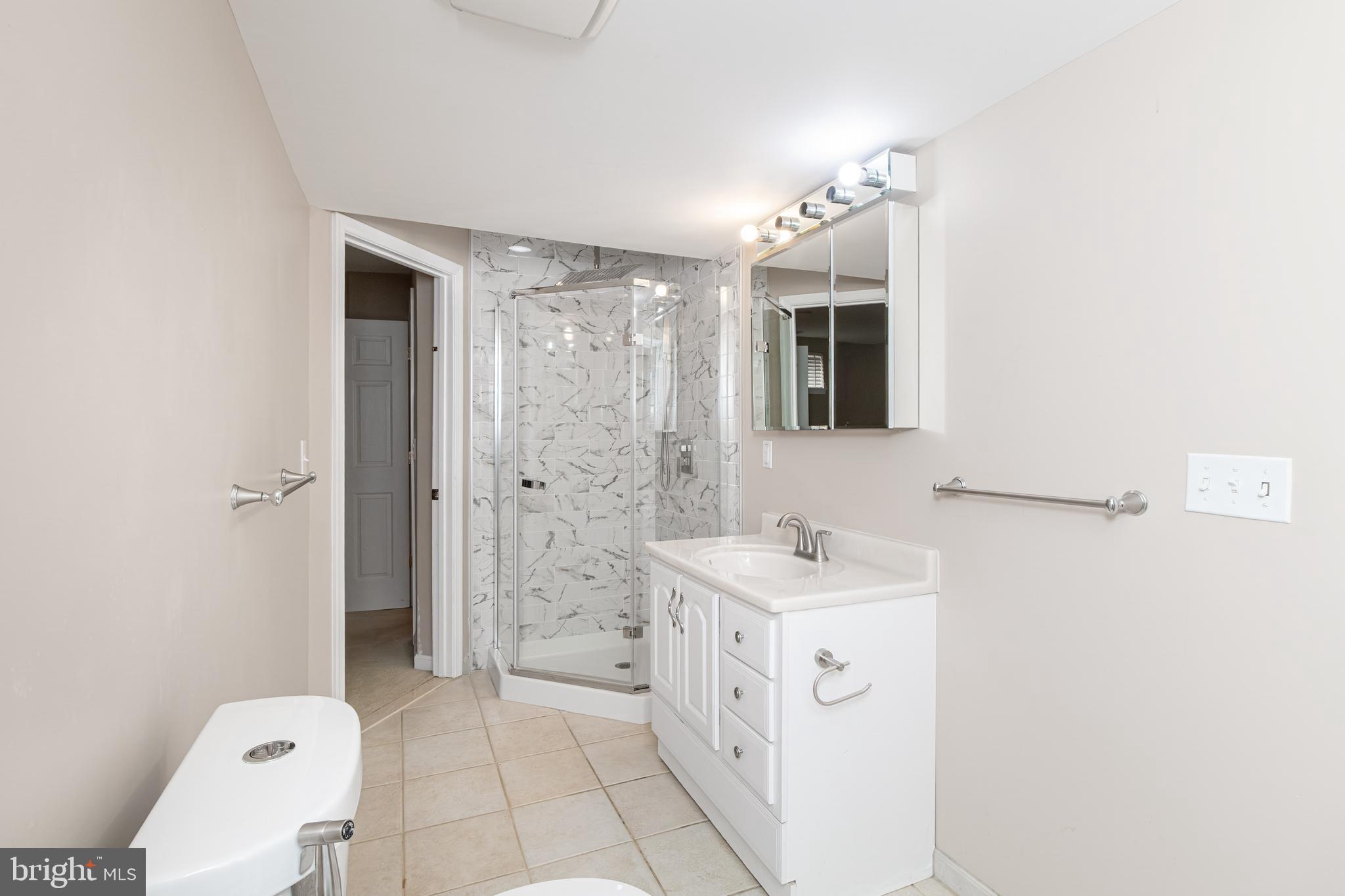 6239 Willowfield Way Springfield, VA 22150 - Photo 42 of 45 a spacious bathroom with a bathtub sink mirror and toilet