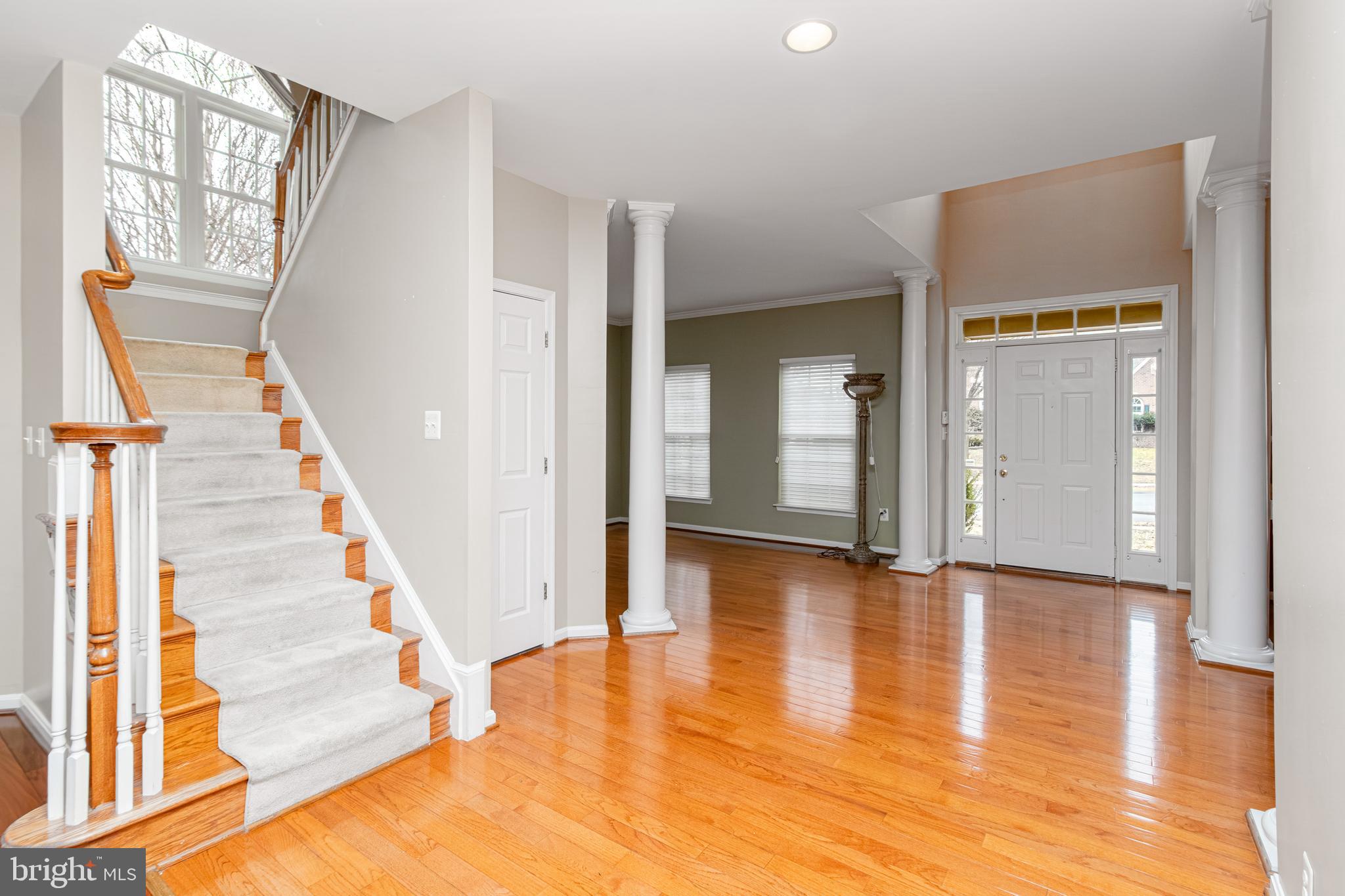 6239 Willowfield Way Springfield, VA 22150 - Photo 6 of 45 a view of an entryway with wooden floor and door
