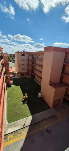 swimming pool view with a seating space