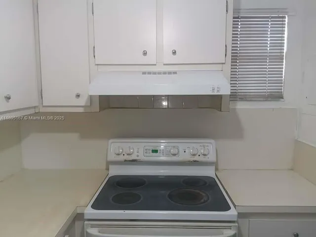 a view of washer and dryer with kitchen countertop