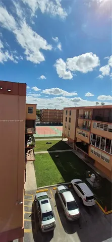 a view of a swimming pool with a yard