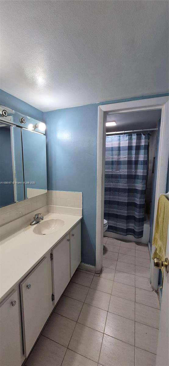 1850 West 56th Street, Unit 2410 Hialeah, FL 33012 - Photo 7 of 12 a bathroom with a sink and a mirror