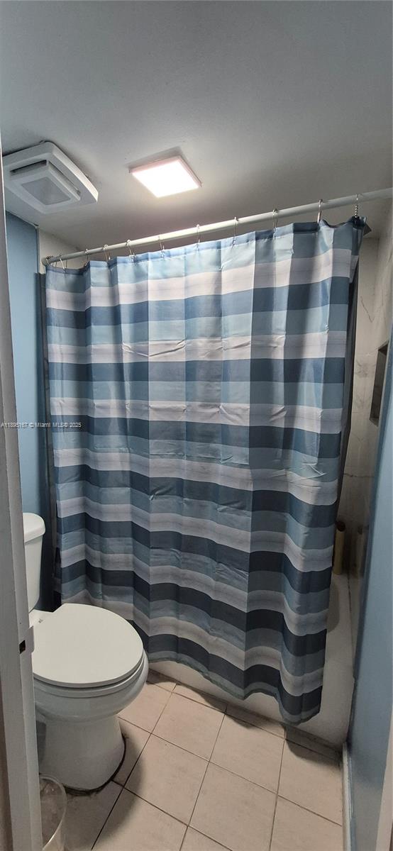 1850 West 56th Street, Unit 2410 Hialeah, FL 33012 - Photo 8 of 12 a bathroom with a toilet and a shower