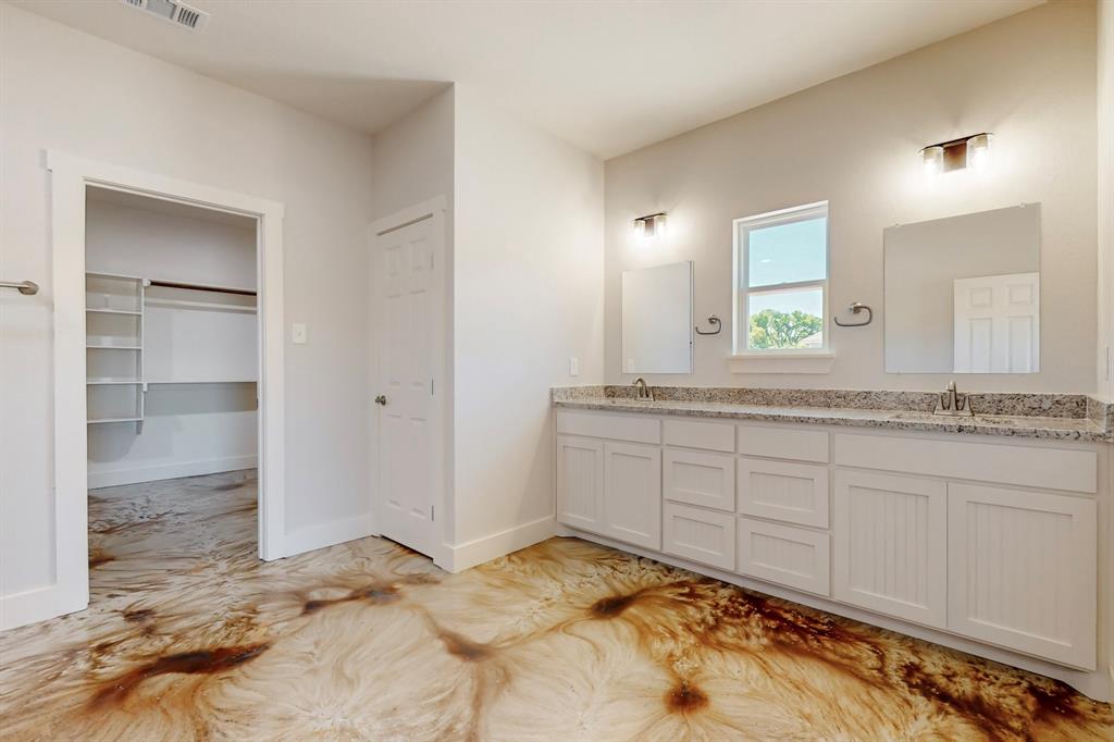 2030 Shoemaker Road Bellevue, TX 76228 - Photo 3 of 6 a bathroom with a sink and a mirror