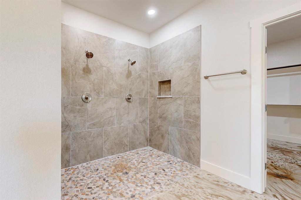 2030 Shoemaker Road Bellevue, TX 76228 - Photo 4 of 6 a bathroom with a shower