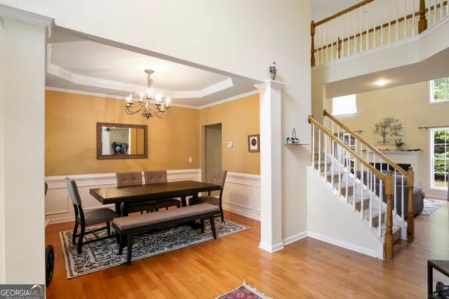 a view of a livingroom with furniture and a table wooden floor