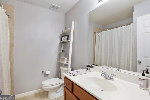 a view of a hallway with seating area