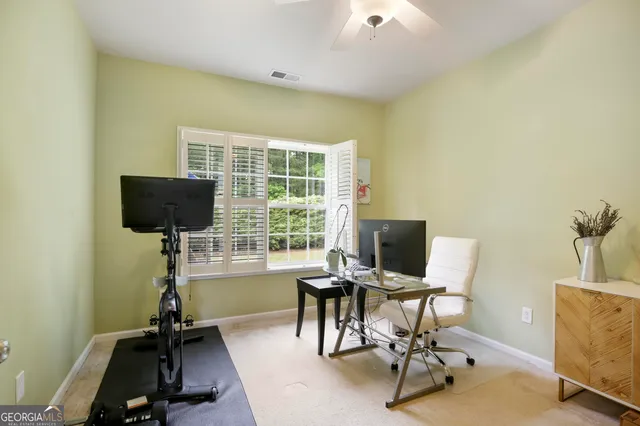 a view of backyard with seating space and trees