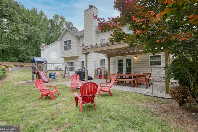 a backyard of a house with seating space