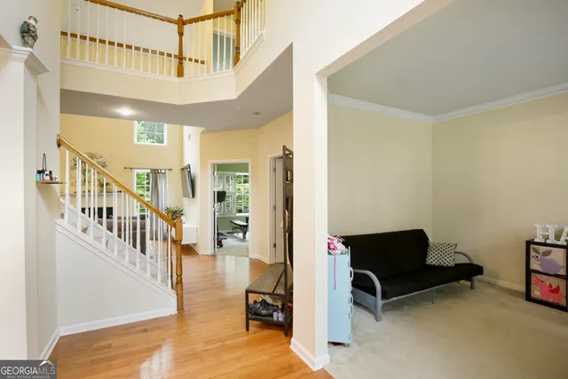 a view of a livingroom with furniture and staircase