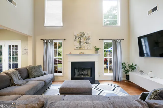 a living room with furniture or fireplace and a flat screen tv