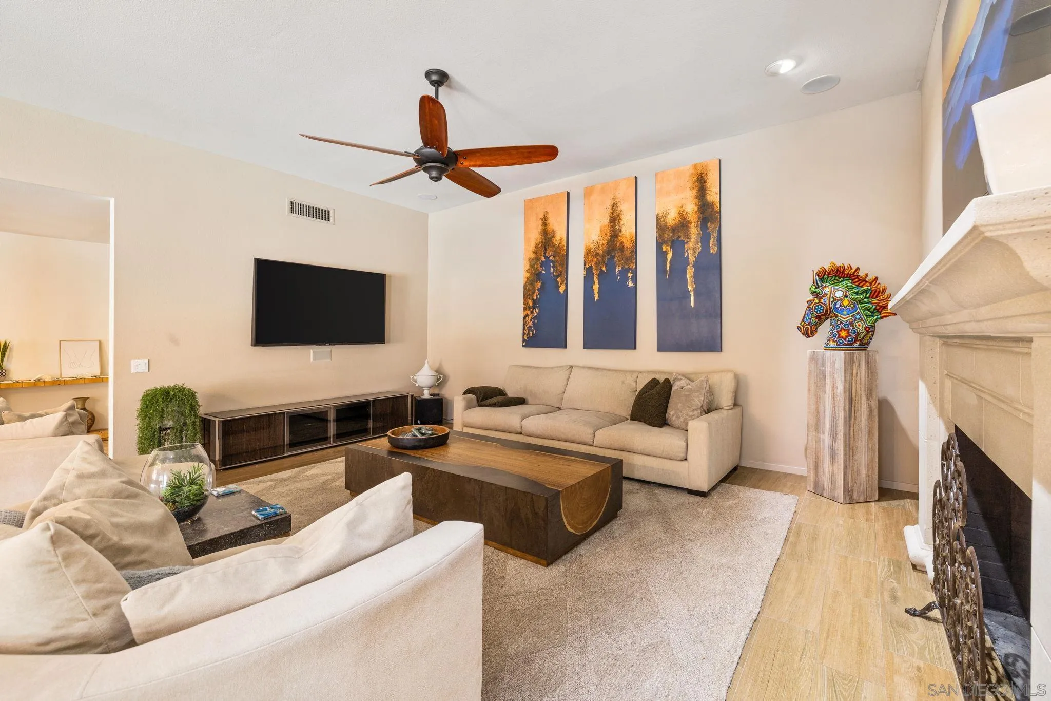 142 Yale Drive Rancho Mirage, CA 92270 - Photo 12 of 72 a living room with furniture a fireplace and a flat screen tv