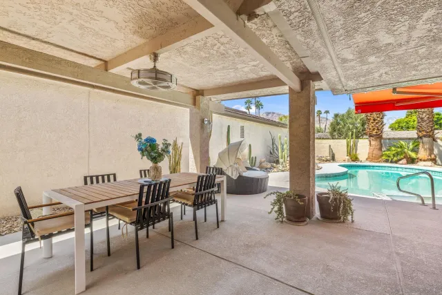 a view of a swimming pool with a patio