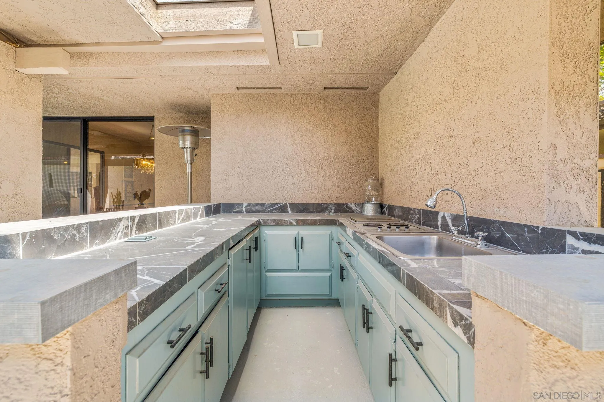 142 Yale Drive Rancho Mirage, CA 92270 - Photo 22 of 72 a kitchen with a sink stove and cabinets