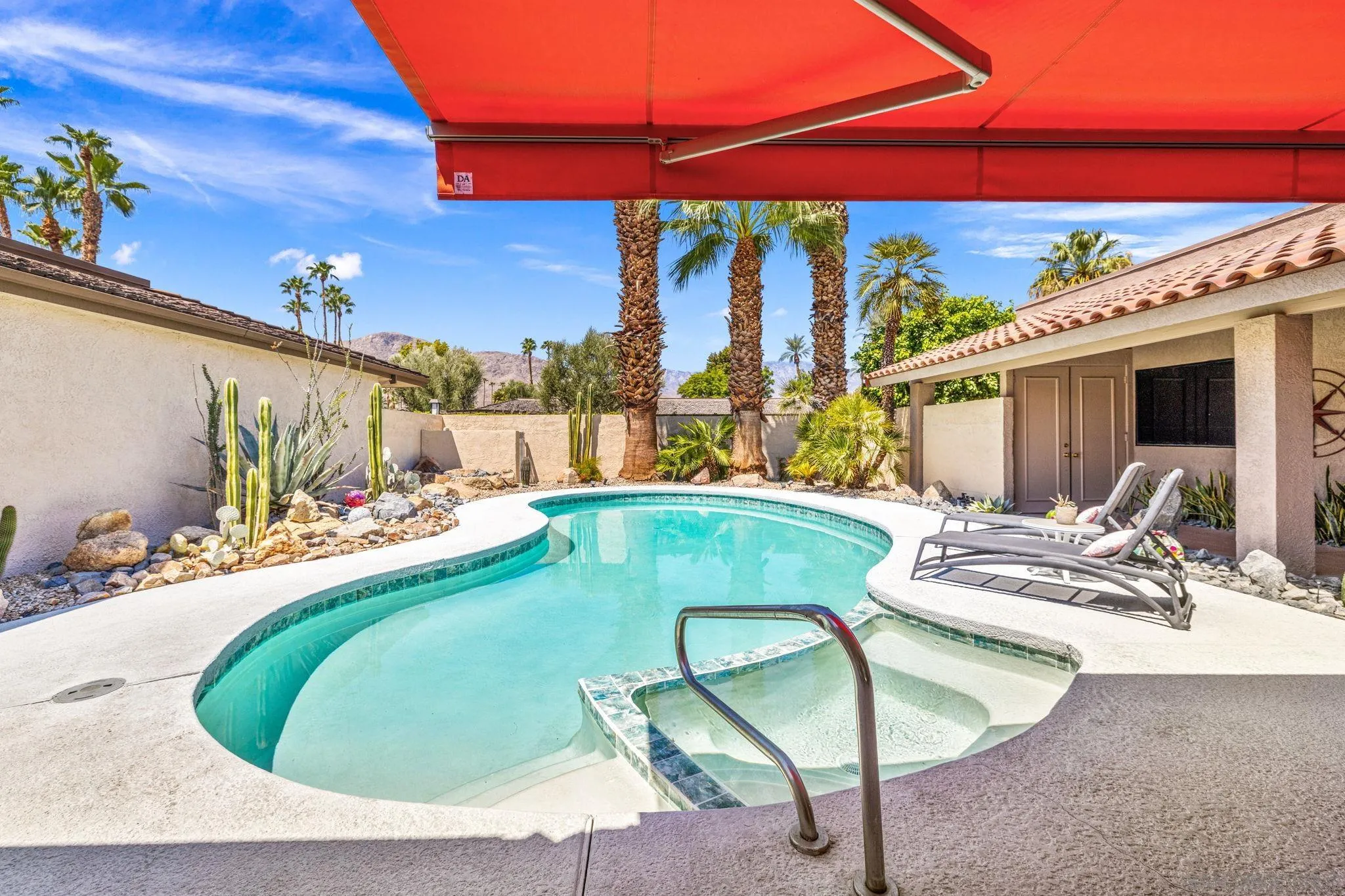 142 Yale Drive Rancho Mirage, CA 92270 - Photo 24 of 72 a view of a swimming pool with a chairs in patio