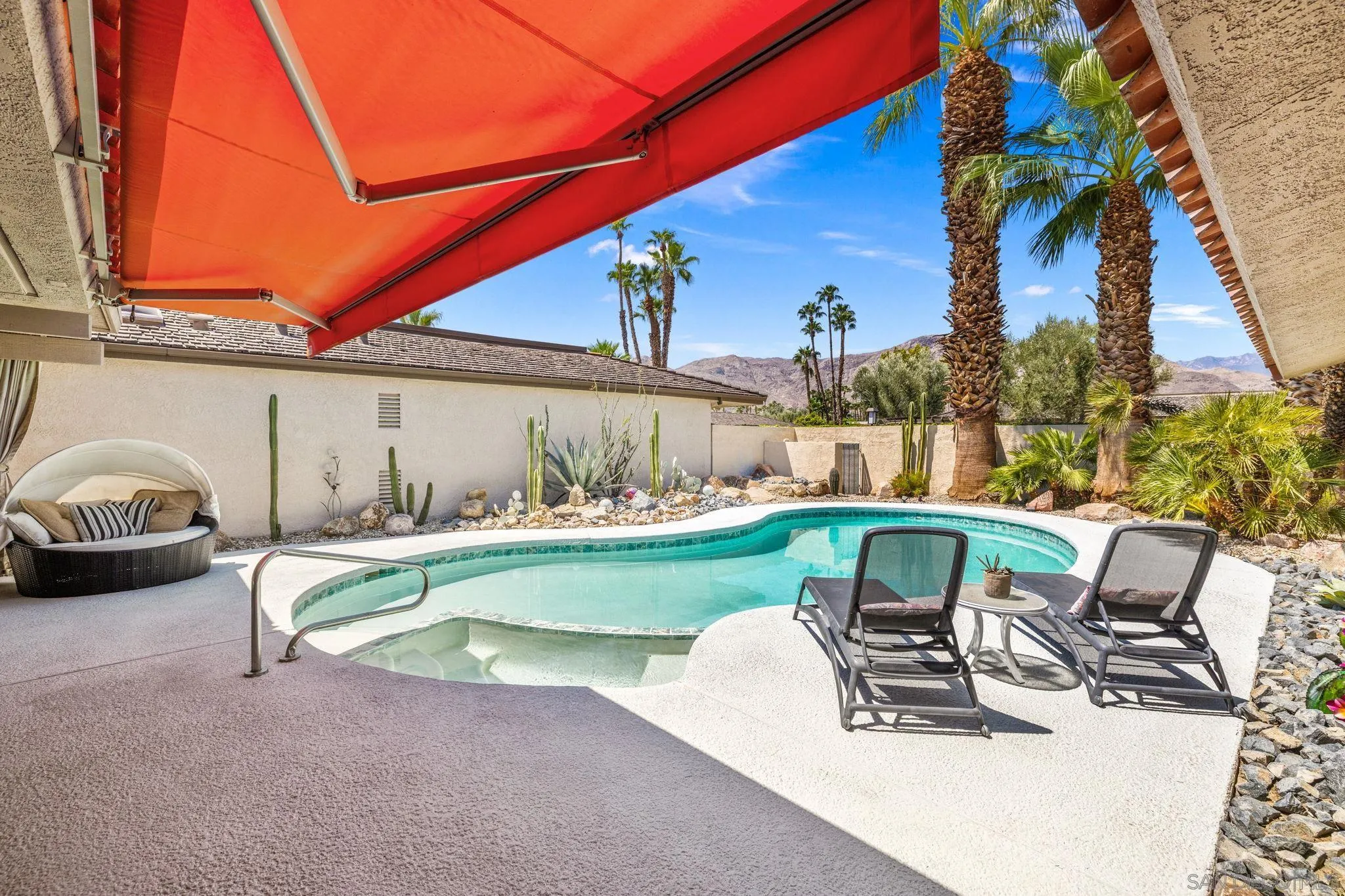 142 Yale Drive Rancho Mirage, CA 92270 - Photo 25 of 72 a view of backyard with swimming pool and table and chairs
