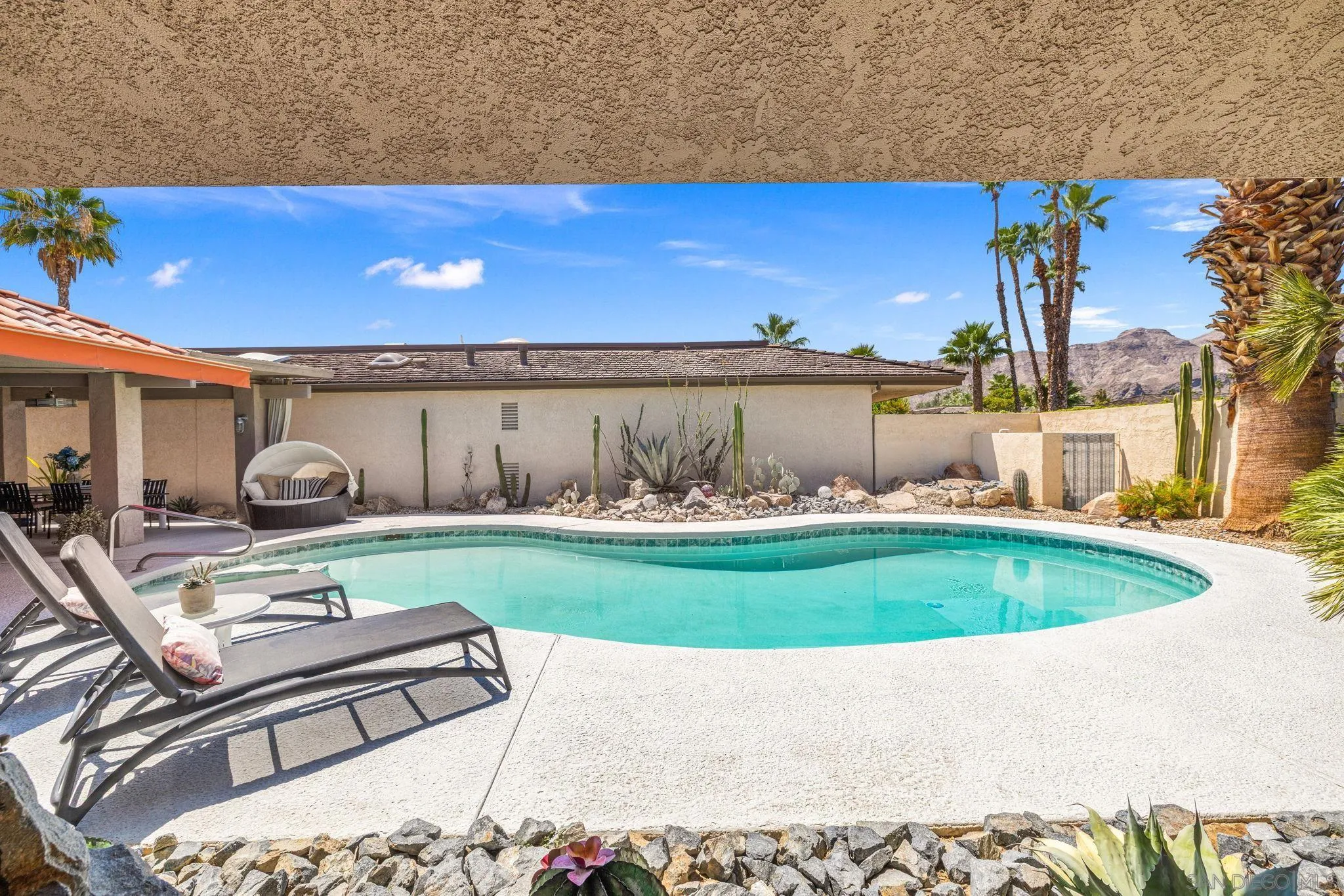 142 Yale Drive Rancho Mirage, CA 92270 - Photo 27 of 72 a view of swimming pool outdoor seating