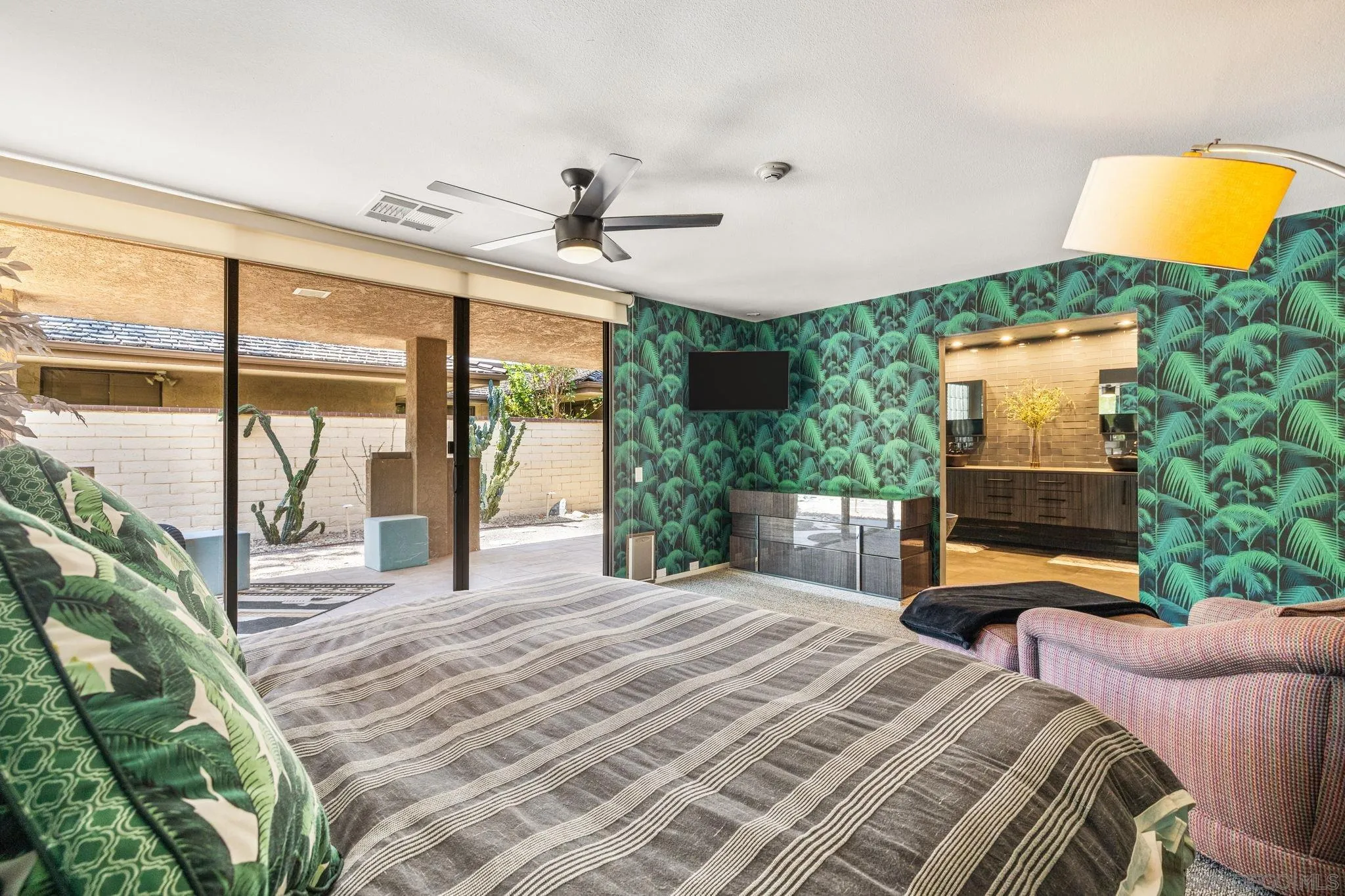 142 Yale Drive Rancho Mirage, CA 92270 - Photo 48 of 72 a bedroom with a bed mirror and a large window