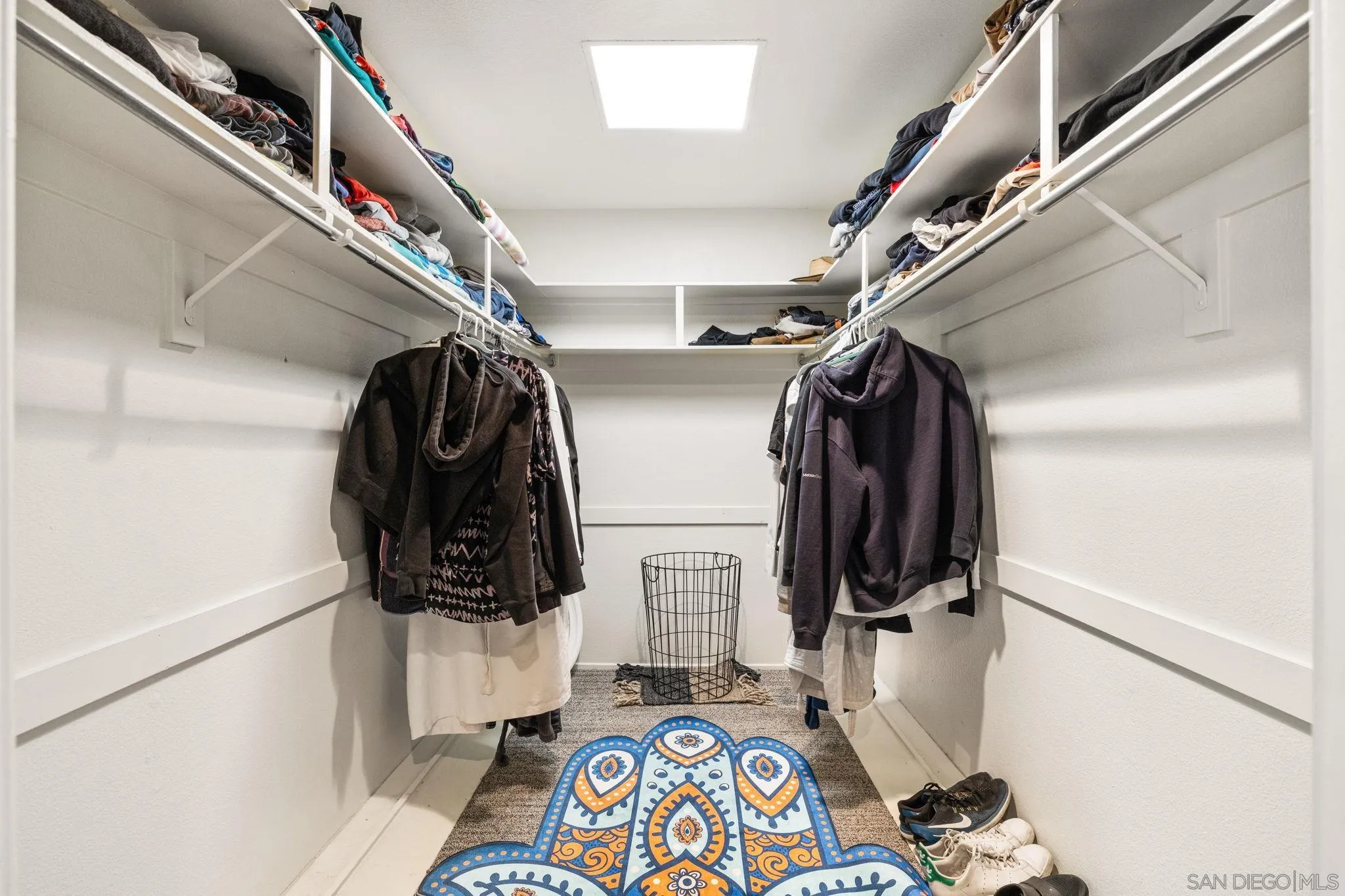 142 Yale Drive Rancho Mirage, CA 92270 - Photo 55 of 72 a view of walk in closet with clothes and shoes