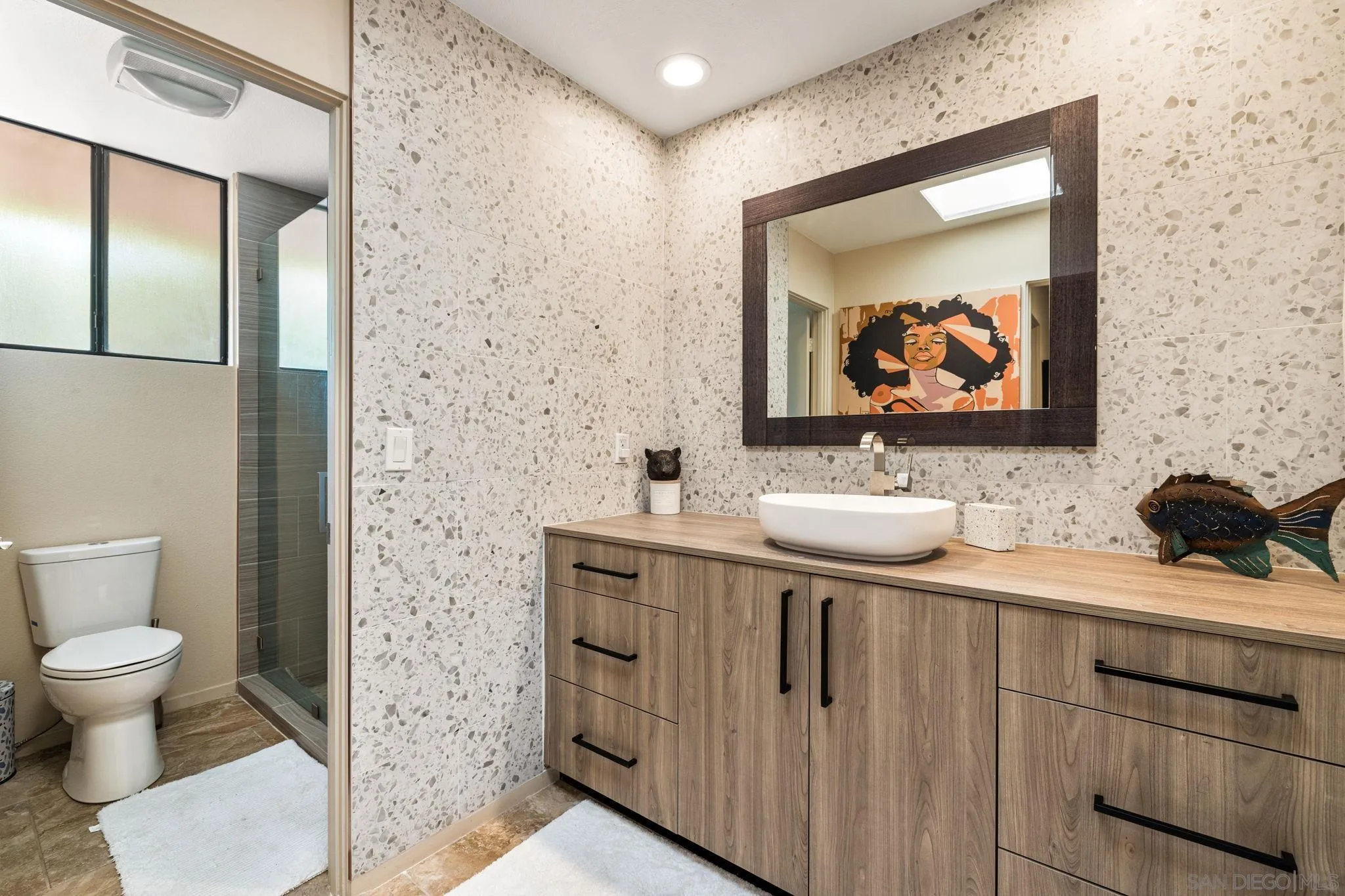 142 Yale Drive Rancho Mirage, CA 92270 - Photo 60 of 72 a bathroom with a toilet sink and mirror