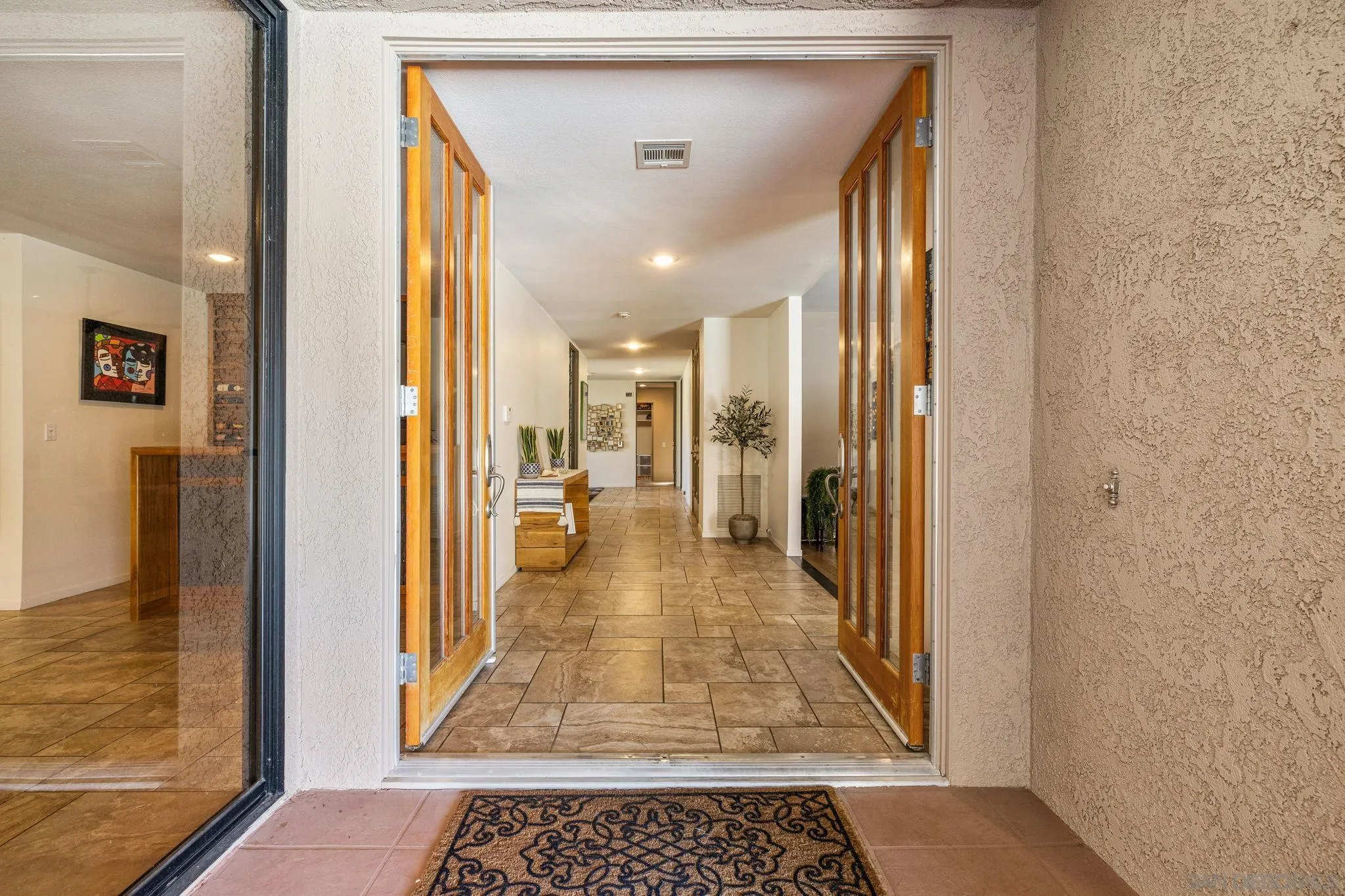 142 Yale Drive Rancho Mirage, CA 92270 - Photo 8 of 72 a view of a hallway with a living room