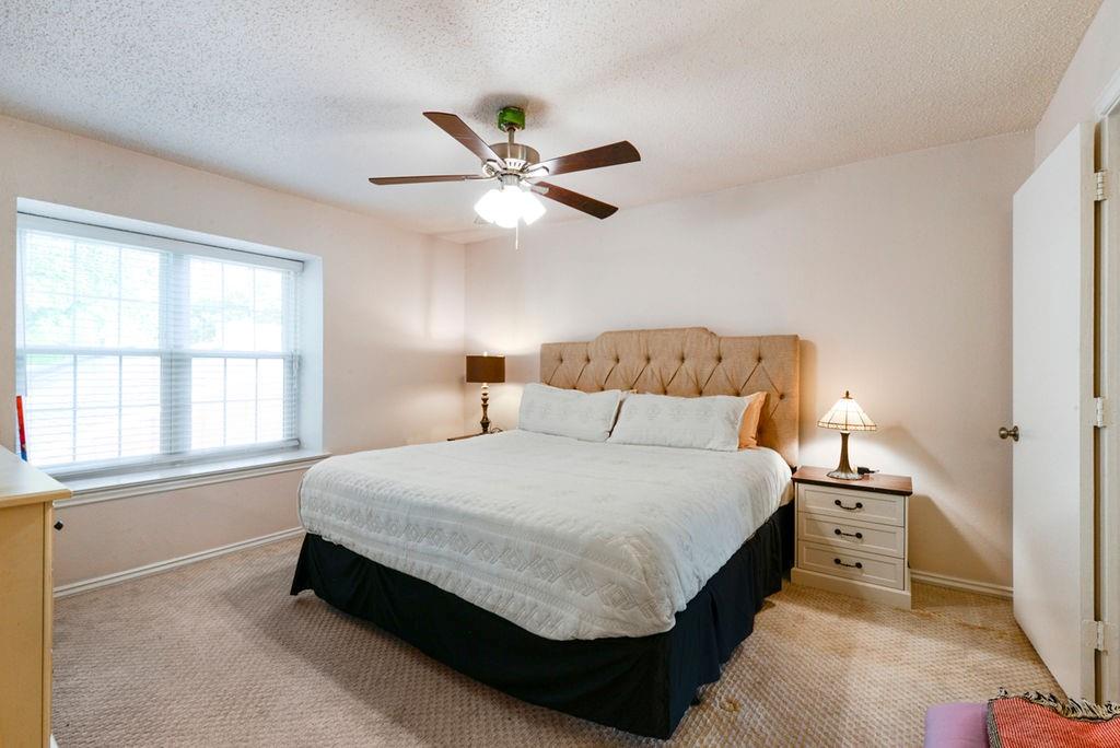 933 Roaring Springs Road Fort Worth, TX 76114 - Photo 19 of 25 a bedroom with a bed and a window