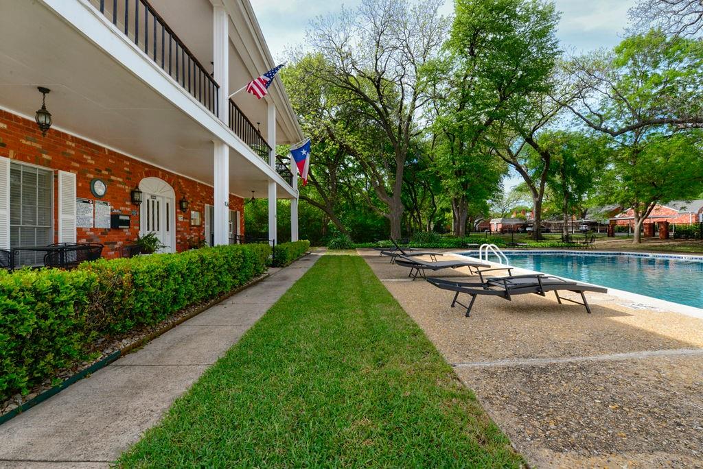 933 Roaring Springs Road Fort Worth, TX 76114 - Photo 24 of 25 a view of a lake with a bench and a yard