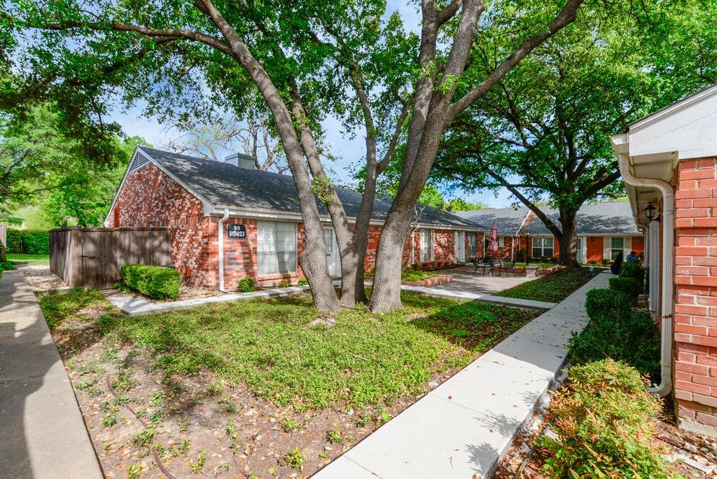 933 Roaring Springs Road Fort Worth, TX 76114 - Photo 5 of 25 a front view of a house with a yard